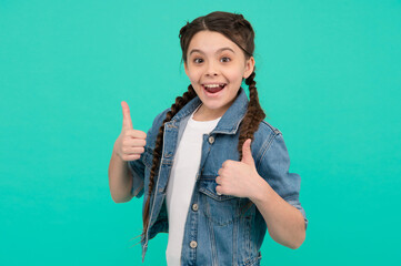 Best version of you. Happy kid give thumbs ups blue background. Little girl smile gesturing thumbs ups. Approval gesture. Hand sign. Hair salon. Trendy style. Fashion trend. Spread your charm