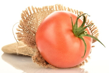 Juicy, pink tomatoes, close-up, on a white background.