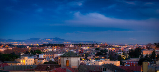 Fototapeta premium Panorama of Rome city at dusk with beautiful architecture, Italy