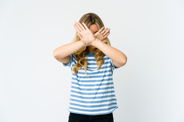Young caucasian blonde woman keeping two arms crossed, denial concept.