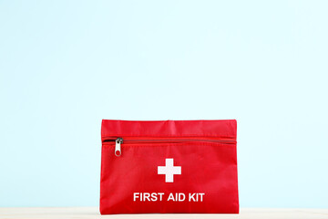 First aid kit on mint background
