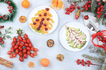 Christmas new year food, detox diet concept, traditional holiday tangerine and vegetable salads, food design idea, flat lay, selective focus