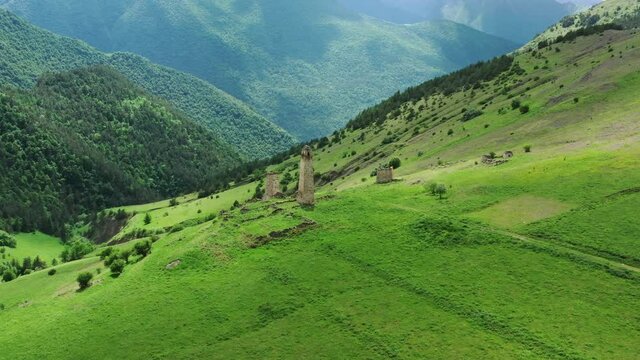 Aerial view of medieval tower complex in the mountains of Ingushetia, Russia, 4k