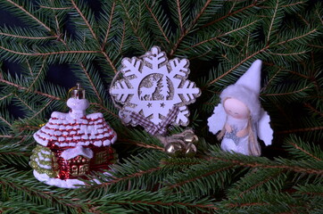Christmas toys on the background of fir branches