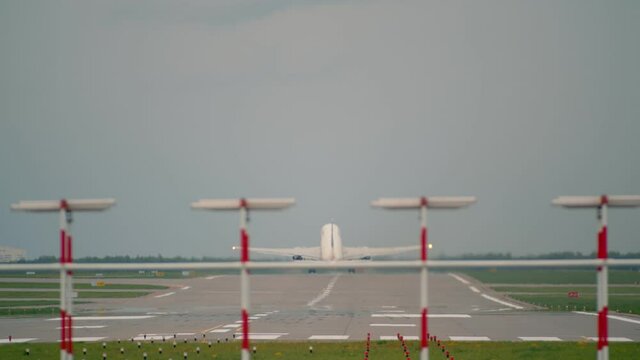 A large passenger plane takes off from the runway and rises into the sky