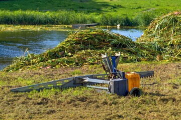 Attachments to the tractor. Cleaning the lake from water lilies and reeds.