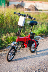 Electric bicycle in the park on sunny summer day.