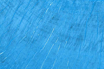 Abstract blue background with cracks. Grunge background.