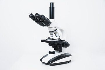 Biological microscope on a gray stone background. Scientific concept, biology. Conducting biological research, checking tissues.