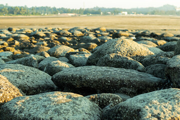 Many stone on the sea beach tourist area closeup