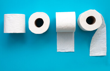 Toilet paper roll on blue background.