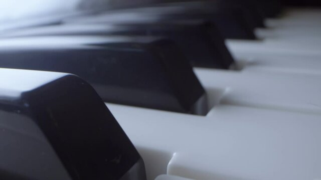 Extreme close-up, detailed. black and white piano keys.