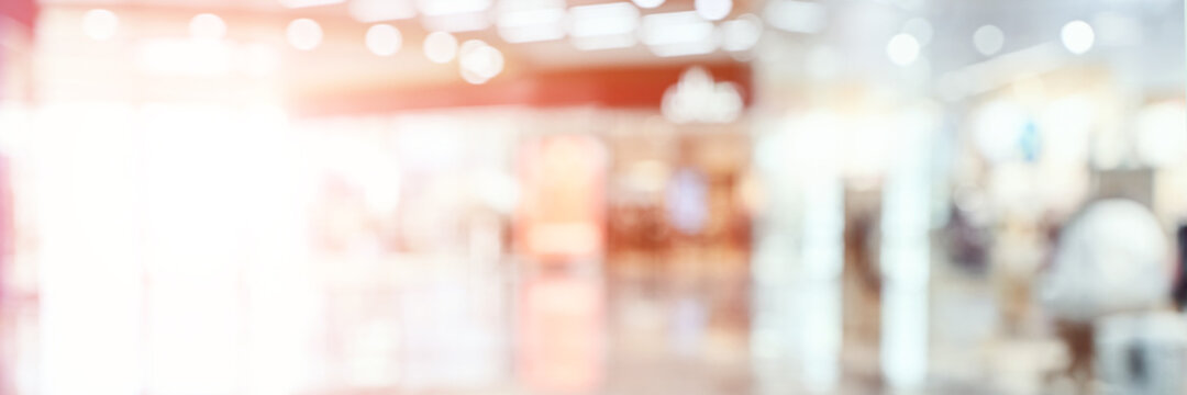 Empty blurry mall background. DeFocused wallpaper. Business office interior. Light lifestyle supermarket. Bokeh effect. Holiday backdrop. Copyspace for text. Ready for card or site design