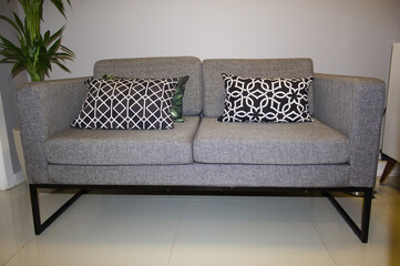 Sofa in a waiting room with pillows
