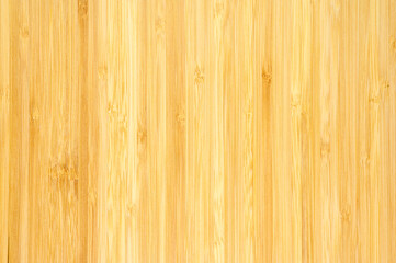 Wooden background in warm shade. Narrow vertical slats. Wood texture. Focusing in the center of the frame.