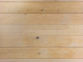 Wood background. The texture of a smooth oak board with sparse knots.