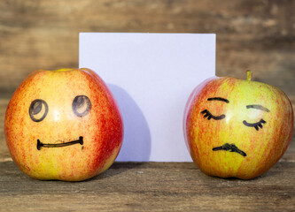 abstract image of couple hide your human emotions from others. different emotions from happy smile joy to sadness and anger Face on an apples
