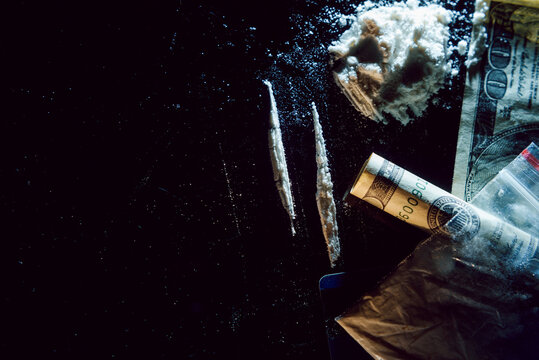 Hard drugs on black table. Close up