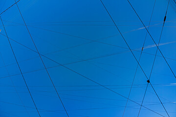 Wires in the blue sky, polluted city sky space and Cityscape, background