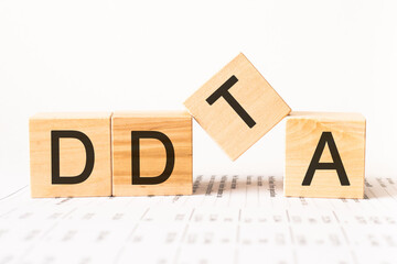 Word ddta. Wooden small cubes with letters isolated on white background with copy space available