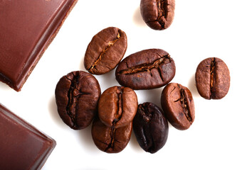 pieces of chocolate and roasted coffee beans isolated on white. flat lay