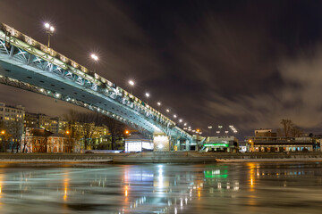 Fototapeta premium Winter view on Moscow river, citiscape with New Year illumination.
