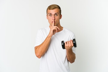 Young caucasian man holding a weight isolated on white background