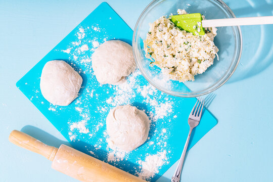 Overhead view of dough with mixture on table