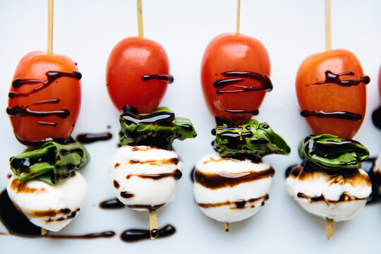 Close up of marshmallows with vegetables on table