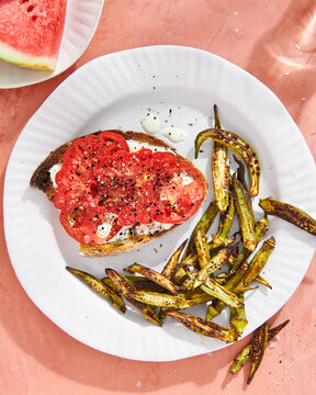 Overhead view of bruschetta served with fried okra on plate