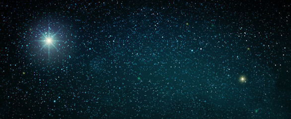 Obraz premium Christmas Star on dark abstract sky. Christmas background.