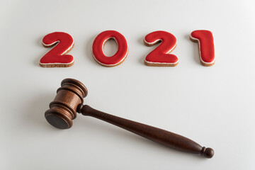 Red lettering 2021 and judges gavel or hammer for auction on white background.