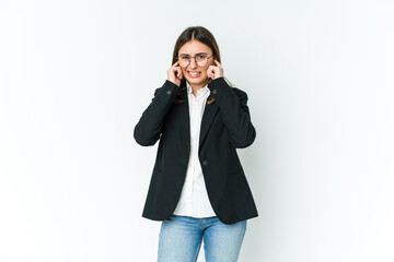 Fototapeta premium Young caucasian business woman covering ears with hands.