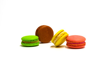 multicolored macarons on a white background