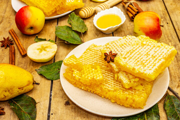 Autumn composition with fresh apples, pears, honeycombs and fragrant spices