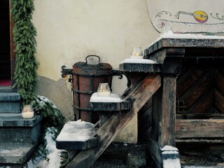 Wooden steps in winter, on which there are candles