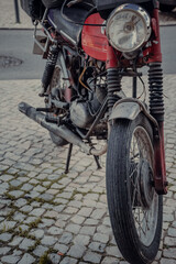 wheel from an old motorcycle. vintage photo of a bike.