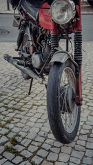 Fototapeta na wymiar wheel from an old motorcycle. vintage photo of a bike.