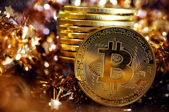Golden Bitcoins on a gold background .Photo (new virtual money )
