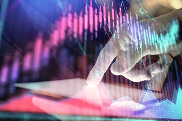 Fototapeta na wymiar Double exposure of man's hands holding and using a digital device and forex graph drawing. Financial market concept.