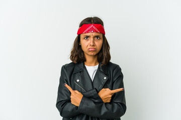 Young latin rocker woman isolated on white background