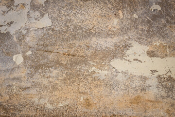 Rain water leaks on the wall causing damage and peeling paint
