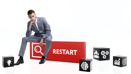 Technology, Internet and network concept. Young businessman shows the word: Restart