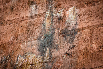 Rain water leaks on the wall causing damage and peeling paint