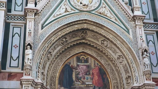 Close up of frescoe of Italian architecture, including Basilica of Santa Croce and Santa Maria del Fiore. Tourism and travel to Italy. Old and ancient building of Florence, painted walls of Cathedral.