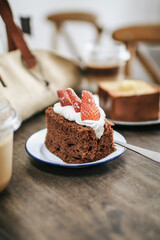 Homemade Chiffon chocolate cake with fresh strawberry and sweet whipped cream. Fresh, colorful, and delicious dessert