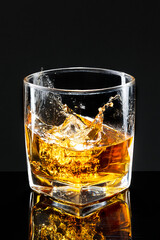 Whiskey on the rocks black background