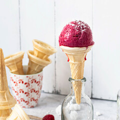 Raspberry ice cream cone in a a glass bottle
