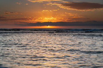 Sun rising on the horizon seascape