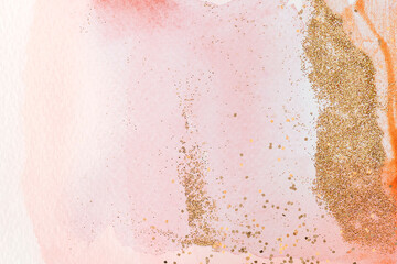 Fototapeta na wymiar Gold glitter on pink watercolor background